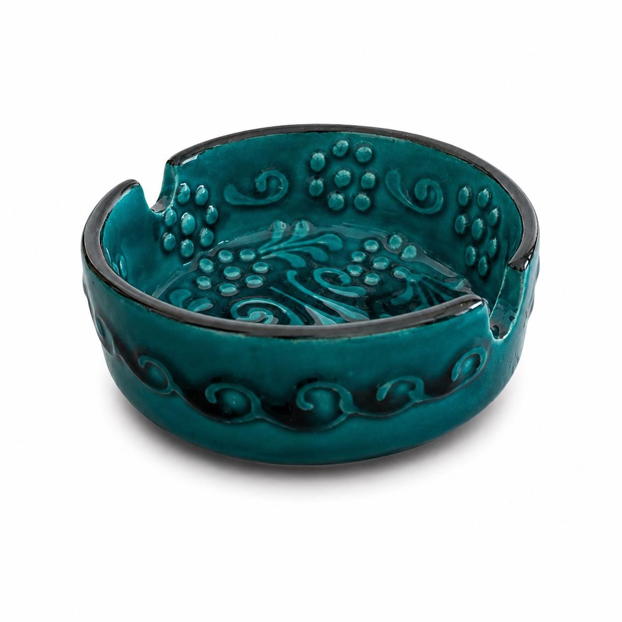 Angled view of the teal embossed ceramic ashtray