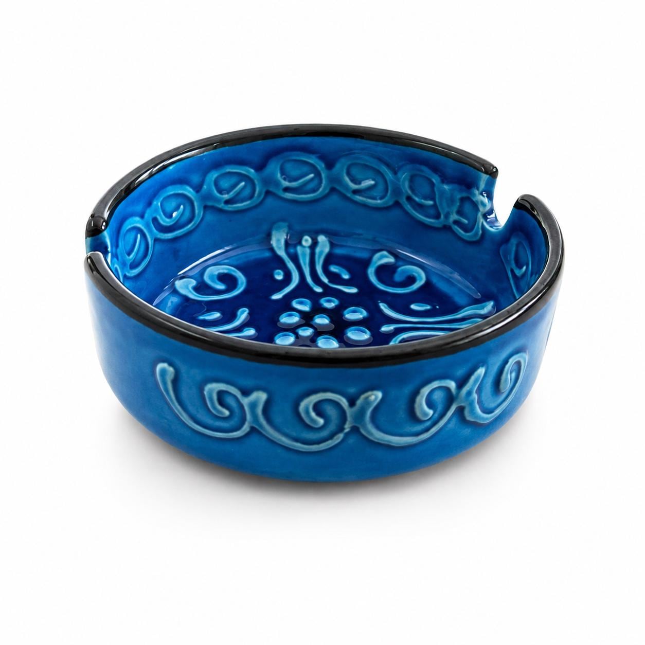 Blue ceramic ashtray with raised swirling decoration