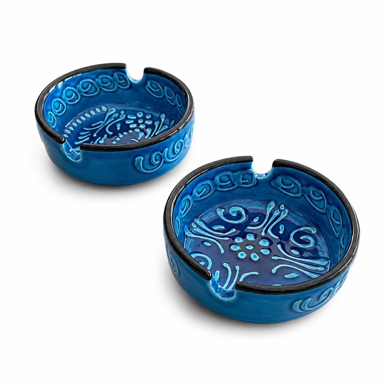 Set of two blue glazed ceramic ashtrays with raised decoration