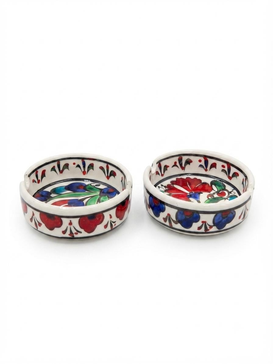 Two ivory ceramic ashtrays with hand-painted floral decoration