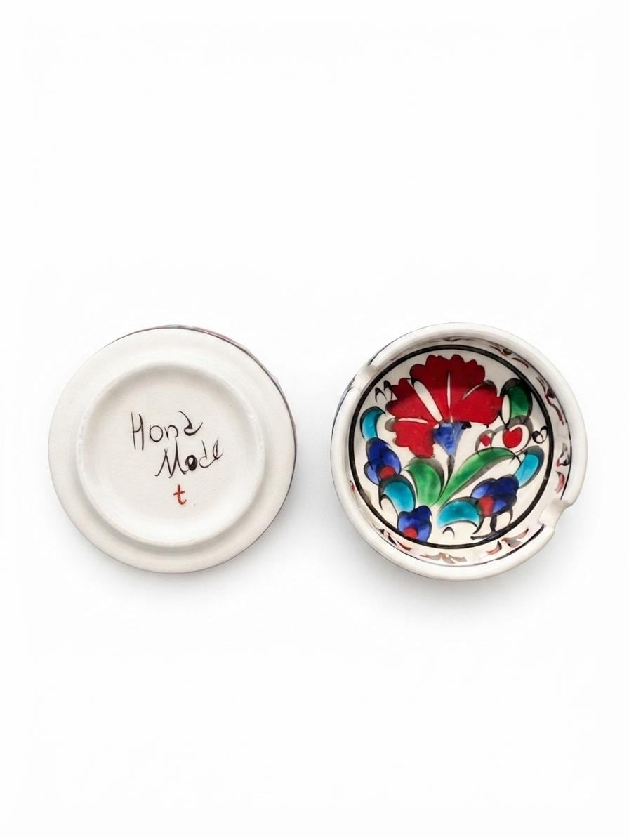 Hand-painted ceramic ashtray showing its handmade underside