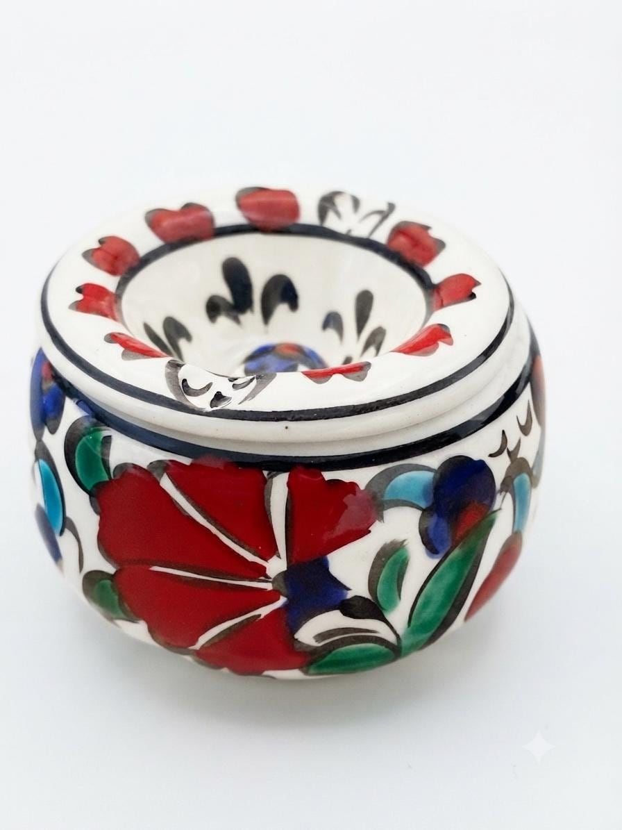 Top view of a hand-painted floral ceramic ashtray
