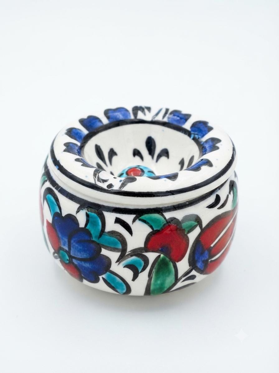 Close view of the floral decoration on a ceramic ashtray